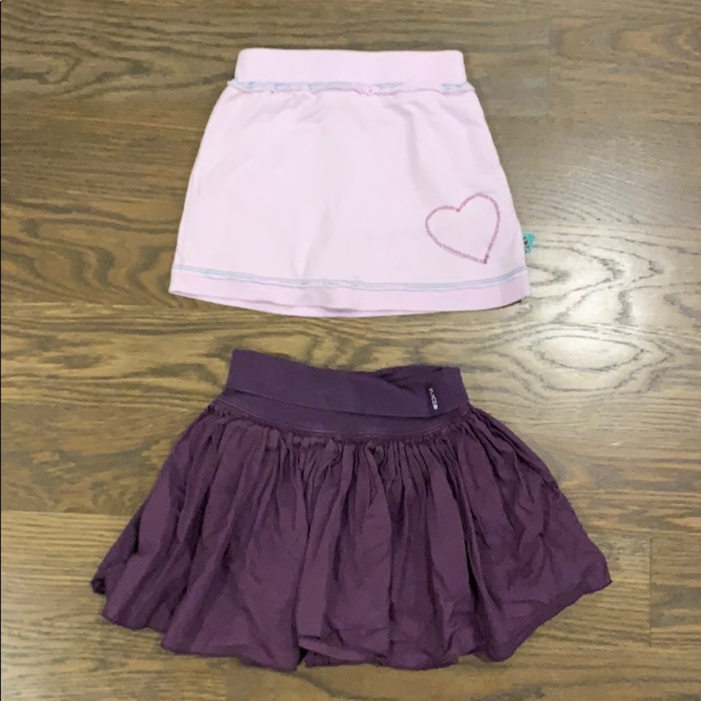 Two pairs of purple skorts. Size 4. No stains